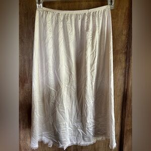 Lorraine size small below knee beige slip